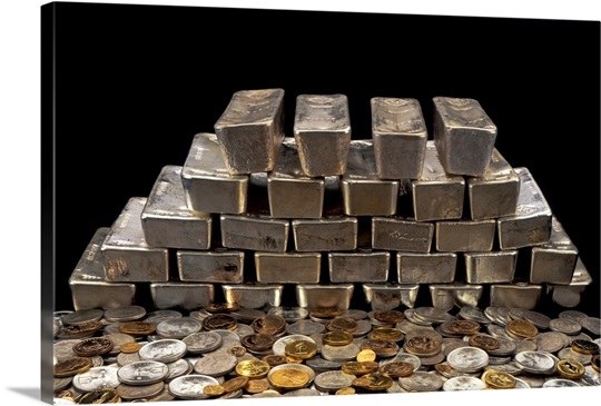 Stack of sliver ingots and pile of coins
