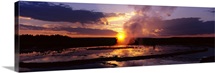 Steam emitting from a natural geyser at sunset, Yellowstone National Park, Wyoming