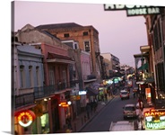 Store signs lit up at dusk, Bourbon Street, New Orleans, LA