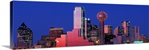 Texas, Dallas, Panoramic view of an urban skyline at night