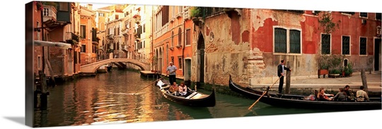 Tourists in a gondola, Venice, Italy