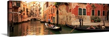 Tourists in a gondola, Venice, Italy