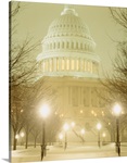 US Capitol Building illuminated at night in a snow storm, Washington DC