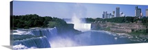 Waterfall with city skyline in the background, Niagara Falls, Ontario, Canada