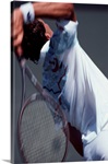 Detail of male tennis player serving
