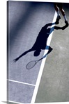 Shadow of tennis player serving