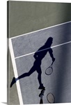 Shadow of tennis player serving