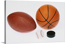 Sports equipment: football, baseball, basketball, hockey puck,