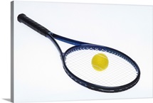 Tennis ball on racquet
