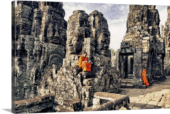 Monk boys reading on the Bayon Temple, Angkor Wat, Cambodia