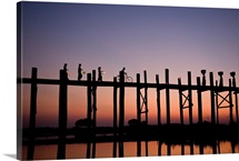 People walking on Ubein Bridge at Sunset, Mandalay, Burma