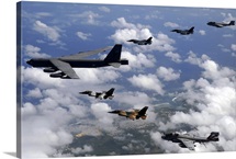 A B52 Stratofortress leads a formation of aircraft over Guam