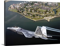 A F/A 22 Raptor flies over Fort Monroe