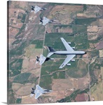 A KC-135R Stratotanker refuels four F-15 Eagles over Oregon