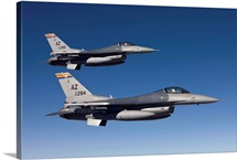 A pair of F-16s fly in formation over Arizona