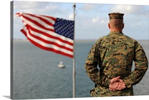 A soldier stands at attention on USS Bonhomme Richard