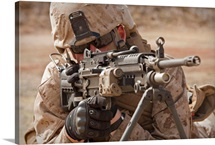 A squad automatic weapon gunner provides security