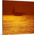 Aircraft carrier at sunset