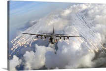An AC 130U gunship jettisons flares over Florida