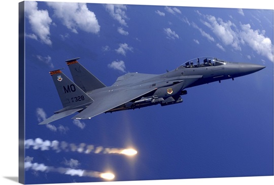 An Air Force F15E Strike Eagle fires flares off the coast of Guam