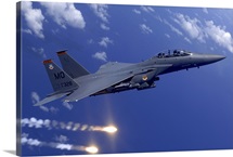 An Air Force F15E Strike Eagle fires flares off the coast of Guam