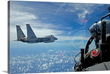 An F-15 Eagle pilot flies in formation with his wingman