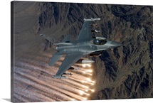 An F-16 Fighting Falcon releases flares during a training mission