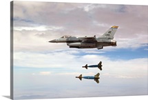 An F-16 Fighting Falcon releases two GBU-24 laser guided bombs
