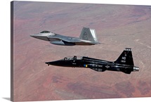 An F-22 Raptor and a T-38 Talon fly in formation over New Mexico