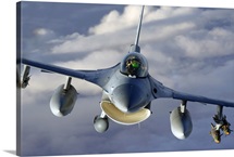 An F16 Fighting Falcon soars through the sky