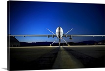 An MQ9 Reaper sits on the flightline