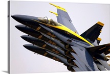 Four Blue Angels F/A18C Hornets perform the Echelon Parade maneuver