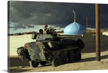 Light armored vehicle commander mans the M240G machine gun