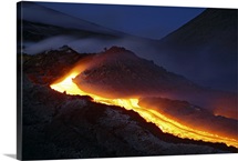 Mount Etna lava flow at night Sicily Italy