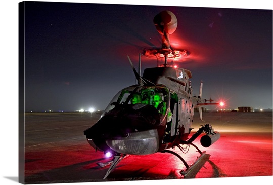 OH58D Kiowa pilots run through their preflight checks before taking off