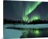 Reflected aurora over a frozen Laksa Lake, Nordland, Norway