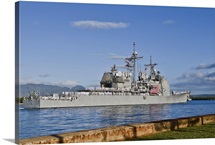 Sailors aboard the guided-missile cruiser USS Port Royal man the rails