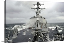 Sea spray whips across the deck of the USS Winston S Churchill