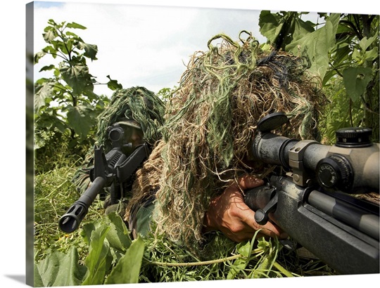 Soldiers dressed in ghillie suits