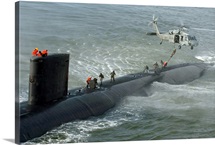 Soldiers perform a fastroping exercise from a MH60S Seahawk to the topside of USS Toledo