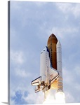 Space Shuttle Atlantis lifts off from its launch pad toward Earth orbit