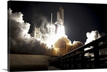 Space shuttle Endeavour lifts off into the night sky from Kennedy Space Center