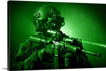 Special operations forces soldier equipped with night vision and an HK416 assault rifle