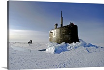 Submarine USS Connecticut surfaces above the ice