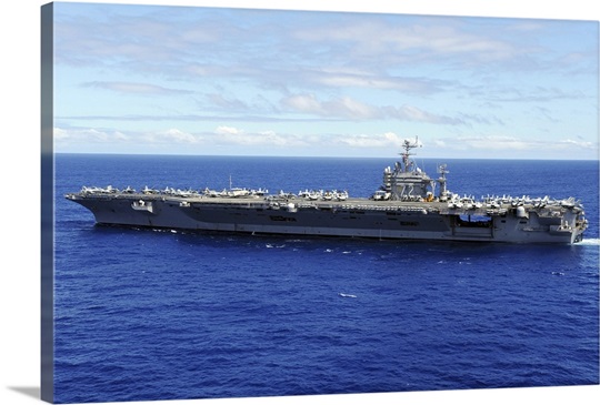 The aircraft carrier USS Abraham Lincoln transits across the Pacific Ocean