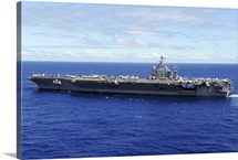 The aircraft carrier USS Abraham Lincoln transits across the Pacific Ocean