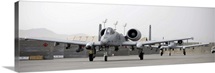 Two A10 Thunderbolts taxi out to the runway