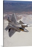 Two F-22 Raptors maneuver while on a training mission over New Mexico