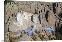 Two F/A18E Super Hornets conduct a fly by of Mount Rushmore