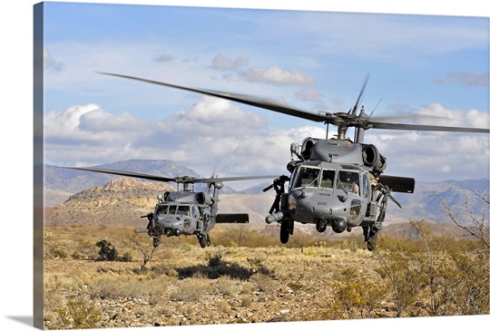 Two HH60 Pavehawk helicopters preparing to land